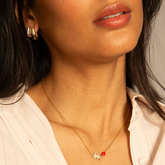 The Kiss Necklace with Points North and Infinity Huggie Earrings