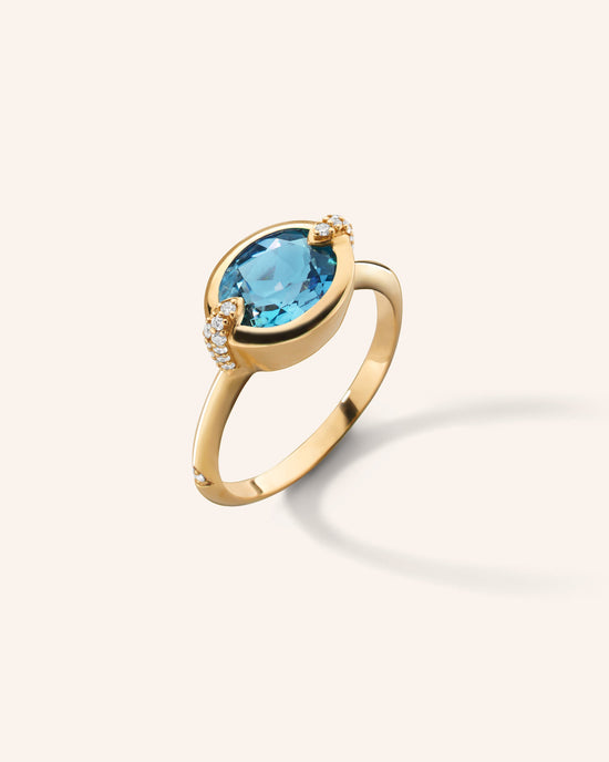 “Points North” Oval London Blue Topaz Ring with Diamonds