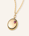 Oval 18K Yellow Gold Locket Necklace with Ruby Heart