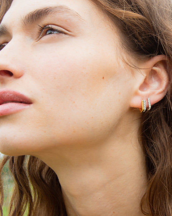 Two-Tone Infinity Huggie Earrings with Sapphires