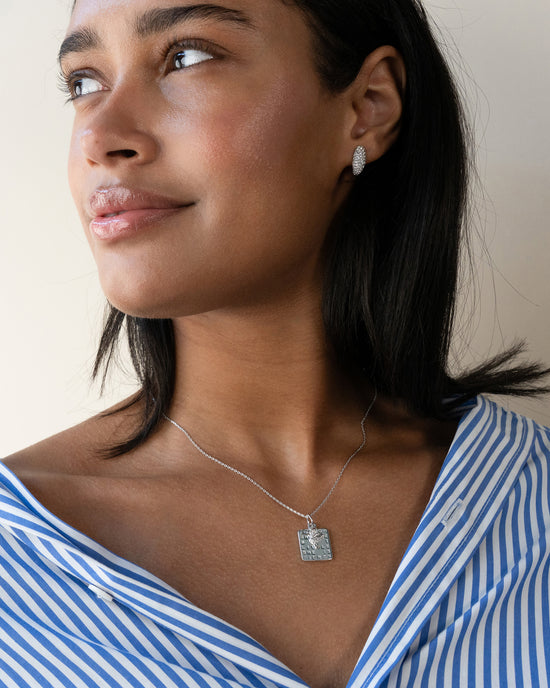 Sterling Silver Perseverance Pave Huggie Earrings