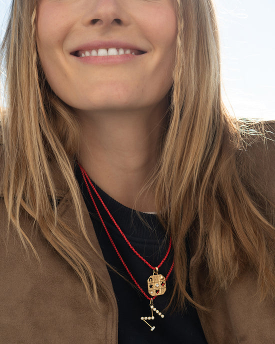 Tokens of Luck Necklace and Diamond Initial Necklace on Red Chains
