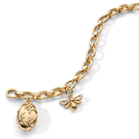 
  
    The “Wisteria” Locket and “Bee” 18K Gold Charm Bracelet
  
